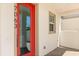 Contemporary front door with a glass panel and the house number, creating curb appeal at 7063 Nemours Pkwy, Orlando, FL 32827