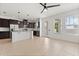 Open-concept kitchen featuring stainless steel appliances and natural light at 7063 Nemours Pkwy, Orlando, FL 32827