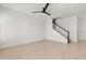 Bright living room featuring staircase and tile floors at 7063 Nemours Pkwy, Orlando, FL 32827