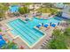 An inviting pool area with lounge seating and umbrellas, perfect for relaxation and recreation at 7063 Nemours Pkwy, Orlando, FL 32827