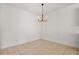 Minimalist room with tile floors and modern chandelier at 7063 Nemours Pkwy, Orlando, FL 32827