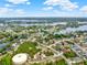 Beautiful aerial view of the community with mature trees, ponds, and other natural Florida landscaping at 780 Kangaroo Ct, Deltona, FL 32738