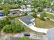 Aerial view of a single-story home with a two-car garage and landscaped yard in a residential neighborhood at 780 Kangaroo Ct, Deltona, FL 32738