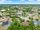 Beautiful aerial view of the neighborhood with mature trees, sidewalks, and community lakes and ponds at 780 Kangaroo Ct, Deltona, FL 32738