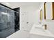 Stylish bathroom with a glass-enclosed shower, marble accents, and double vanity with elegant fixtures at 780 Kangaroo Ct, Deltona, FL 32738