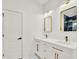 Modern bathroom features double sinks, gold fixtures, and matching gold-trimmed rectangular mirrors at 780 Kangaroo Ct, Deltona, FL 32738