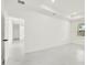 Bright, modern bedroom with sleek marble floors and abundant natural light from a large window at 780 Kangaroo Ct, Deltona, FL 32738