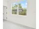 Bright bedroom with a view of the backyard through a large window at 780 Kangaroo Ct, Deltona, FL 32738