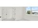 Bedroom with window looking out to a residential home at 780 Kangaroo Ct, Deltona, FL 32738