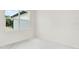 Bright bedroom with white marble floors and a view of the neighborhood at 780 Kangaroo Ct, Deltona, FL 32738