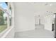 Open living room with marble floors and a view of the modern kitchen at 780 Kangaroo Ct, Deltona, FL 32738