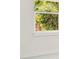 Close up of a window overlooking green trees at 780 Kangaroo Ct, Deltona, FL 32738