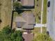 Aerial view of the home showcasing the roof, the surrounding yard, and neighborhood at 11125 Finchley Pl, Orlando, FL 32837