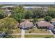 This home features a well-manicured front yard, mature trees and a long driveway at 11125 Finchley Pl, Orlando, FL 32837
