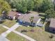 A well-kept single-Gathering home featuring a charming yard with a healthy green lawn and a palm tree at 11125 Finchley Pl, Orlando, FL 32837