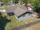 Exterior rear view of home, featuring a fenced-in lawn and a grey exterior at 11125 Finchley Pl, Orlando, FL 32837