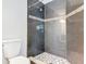 Updated bathroom featuring a stylish shower with modern tiling and mosaic accents at 11125 Finchley Pl, Orlando, FL 32837