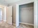 Bedroom walk-in closet showcasing a wire shelving and neutral gray paint at 11125 Finchley Pl, Orlando, FL 32837
