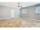 Spacious bedroom featuring tile floors, natural light, and a ceiling fan at 11125 Finchley Pl, Orlando, FL 32837