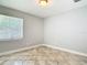 Bedroom with tile flooring, neutral walls, window, and recessed lighting at 11125 Finchley Pl, Orlando, FL 32837