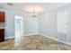 Bright dining area with decorative chandelier at 11125 Finchley Pl, Orlando, FL 32837