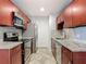 Remodeled kitchen with stainless steel appliances, granite countertops and updated cabinetry at 11125 Finchley Pl, Orlando, FL 32837