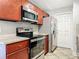 Modern kitchen with stainless steel appliances, sleek countertops, and plenty of storage space at 11125 Finchley Pl, Orlando, FL 32837