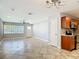 Open-concept living area with updated finishes, tile flooring, and modern lighting fixtures at 11125 Finchley Pl, Orlando, FL 32837