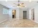 Bright main bedroom with ensuite bathroom, closet, tiled floors, and neutral paint at 11125 Finchley Pl, Orlando, FL 32837