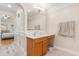 Bathroom vanity with sink, mirror and hardwood floor at 1129 Dartford Dr, Kissimmee, FL 34758