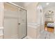 Bathroom shower with ceiling fan and tile at 1129 Dartford Dr, Kissimmee, FL 34758