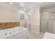 Bright bathroom with a jacuzzi tub and shower stall at 1129 Dartford Dr, Kissimmee, FL 34758