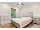 Bedroom features tile floor, fan and natural light at 1129 Dartford Dr, Kissimmee, FL 34758