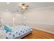 Bedroom with hardwood floors, fan and furnishings at 1129 Dartford Dr, Kissimmee, FL 34758