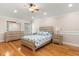 Bedroom with hardwood floors, fan, and furnishings at 1129 Dartford Dr, Kissimmee, FL 34758