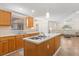 Spacious kitchen with island sink, ample counter space and eat in area with open living area at 1129 Dartford Dr, Kissimmee, FL 34758