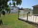Backyard with grassy lawn and white fence at 1155 Roan Ct, Kissimmee, FL 34759