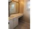 Bathroom with a single sink vanity and framed mirror at 1155 Roan Ct, Kissimmee, FL 34759