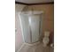 Bathroom with corner shower stall and toilet at 1155 Roan Ct, Kissimmee, FL 34759