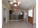 Open dining area with tile floors, pendant lighting, and a bar-top view into the kitchen at 1155 Roan Ct, Kissimmee, FL 34759