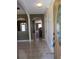 View of the foyer with tile flooring and archways to the dining area and other rooms at 1155 Roan Ct, Kissimmee, FL 34759