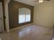 Bright room featuring tile flooring, a ceiling fan, neutral wall colors, and lots of natural light at 1155 Roan Ct, Kissimmee, FL 34759