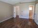 Main bedroom with ensuite bathroom and walk-in closet featuring hardwood floors at 1155 Roan Ct, Kissimmee, FL 34759