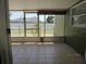 Screened patio with tiled floor and view of the fenced backyard at 1155 Roan Ct, Kissimmee, FL 34759