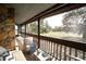 Relax on the screened balcony overlooking manicured green space and swaying mature trees at 12 Robyn Ln, Haines City, FL 33844