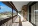 Enjoy amazing views from the screened-in balcony with stone pillar and wood railing at 12 Robyn Ln, Haines City, FL 33844
