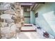 Inviting front entrance with stone accents, a walkway, and landscaping, creating a welcoming ambiance at 12 Robyn Ln, Haines City, FL 33844