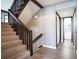 Hallway featuring clean design with stairwell to a second floor and multiple doors to rooms at 12 Robyn Ln, Haines City, FL 33844