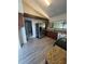 Bright kitchen featuring granite countertops, stainless steel appliances, and laminate flooring at 12 Robyn Ln, Haines City, FL 33844