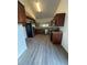 Spacious kitchen equipped with stainless steel appliances, wooden cabinets and granite countertops at 12 Robyn Ln, Haines City, FL 33844